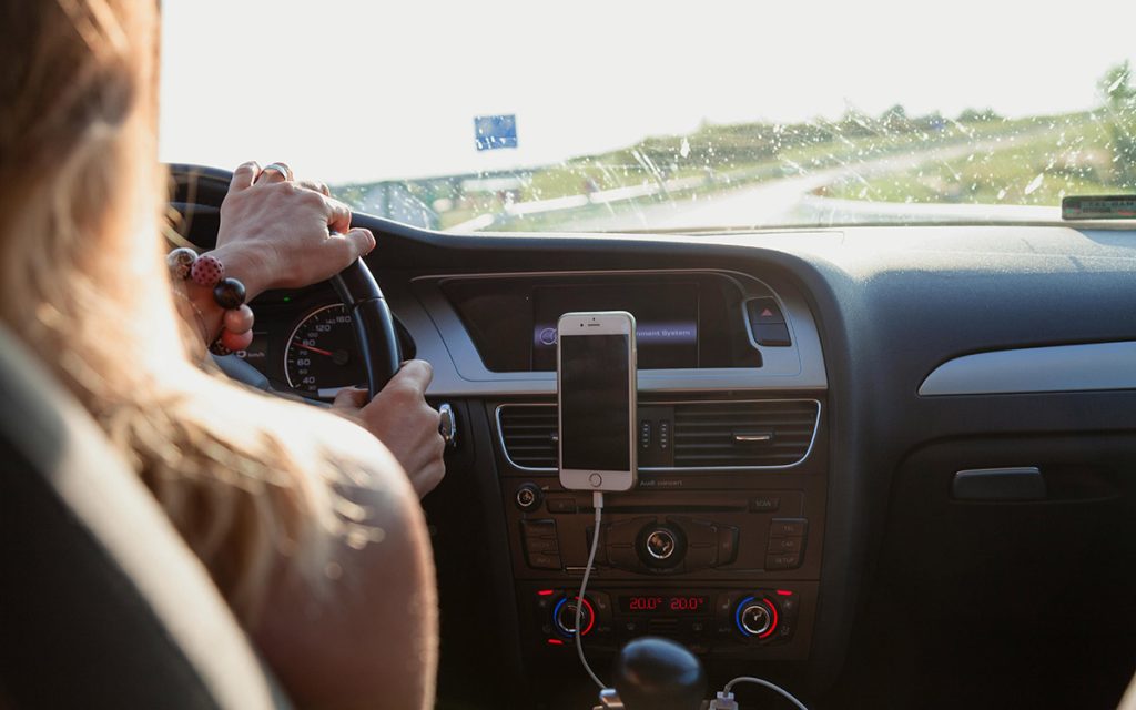 Woman driving her car on the road