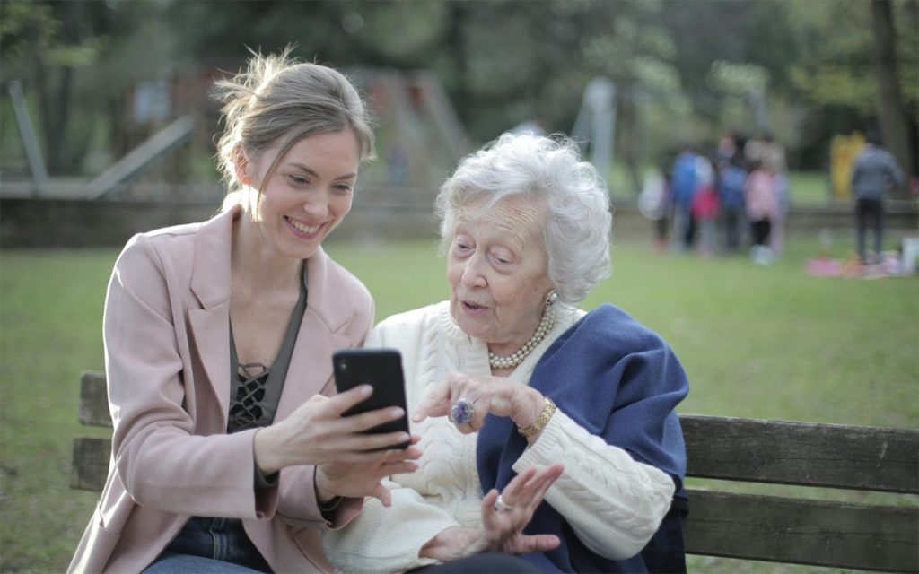 granddaughter with grandma on the phone